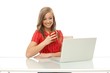© nyul - Young woman using laptop smiling