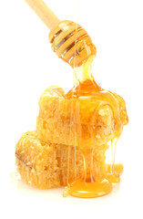 Poster - golden honeycombs and wooden drizzler with honey isolated