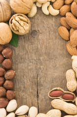 Poster - set of nuts fruit on wood background