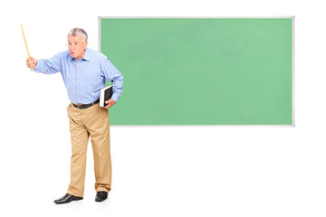 Poster - Angry mature teacher holding a wand and green school board