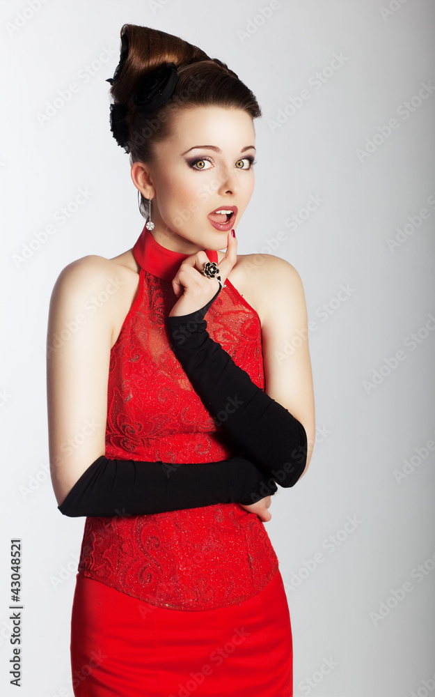 Beautiful girl in red dress and black gloves posing. Stock Photo | Adobe Stock Beautiful girl in red dress and black gloves posing. Stock Photo | Adobe Stock