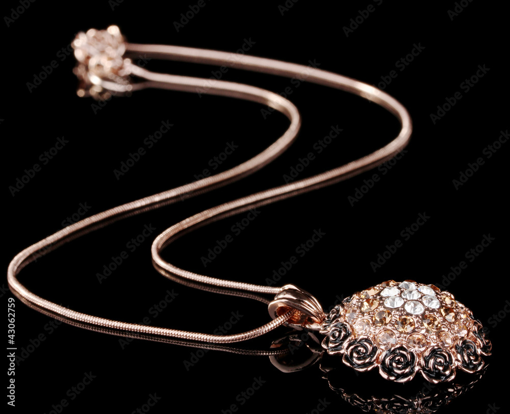 Pendant with flowers and gems isolated on black