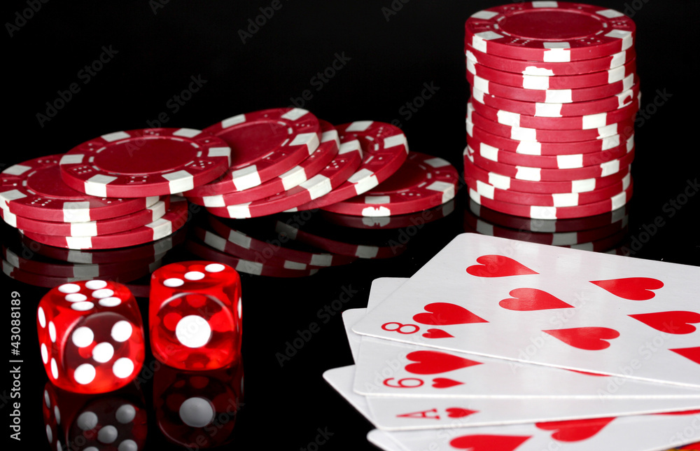 flush with poker chips and dice on black background