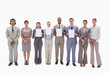 © WavebreakmediaMicro - Business people holding four supports for letters