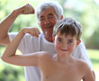 © Denizo - Grandfather and grandson flexing biceps