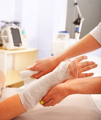 Wall Mural - Bandaging patient in hospital.