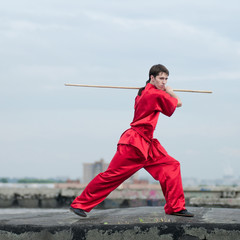 Wall Mural - Wushoo man in red practice martial art