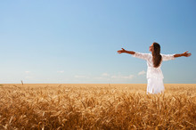 Girl On Wheat Field