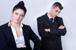 © ctvvelve - modern young business couple posing on gray background