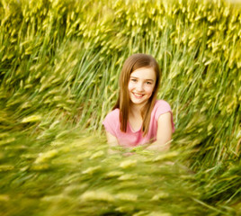 A girl sitting outdoors