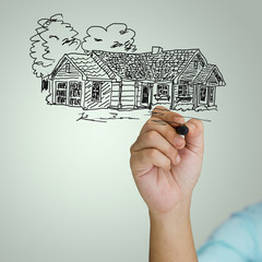 Hand drawing house on green background