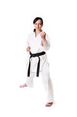 Karate woman posing on a white background