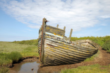 Remains Of Fishing Boat On Norfolk Coast At Blakeney