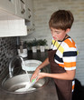 © Denizo - boy doing the dishes
