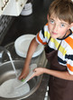 © Denizo - boy doing the dishes