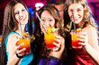 © Kzenon - People with cocktails in bar or club