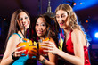 © Kzenon - People drinking cocktails in bar or club
