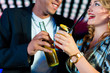 © Kzenon - People with cocktails in bar or club
