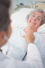 Poster - Elderly patient smiling to a doctor