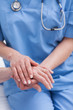© WavebreakmediaMicro - Close up of a nurse holding hand of a patient