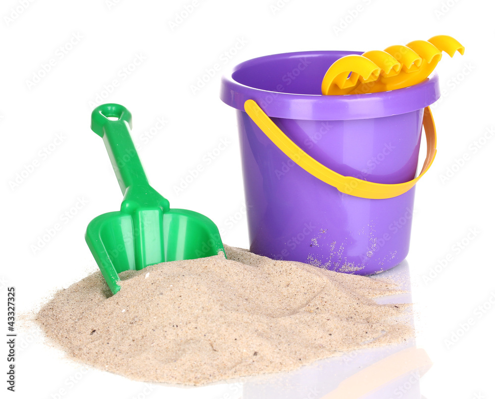 Children's beach toys and sand isolated on white