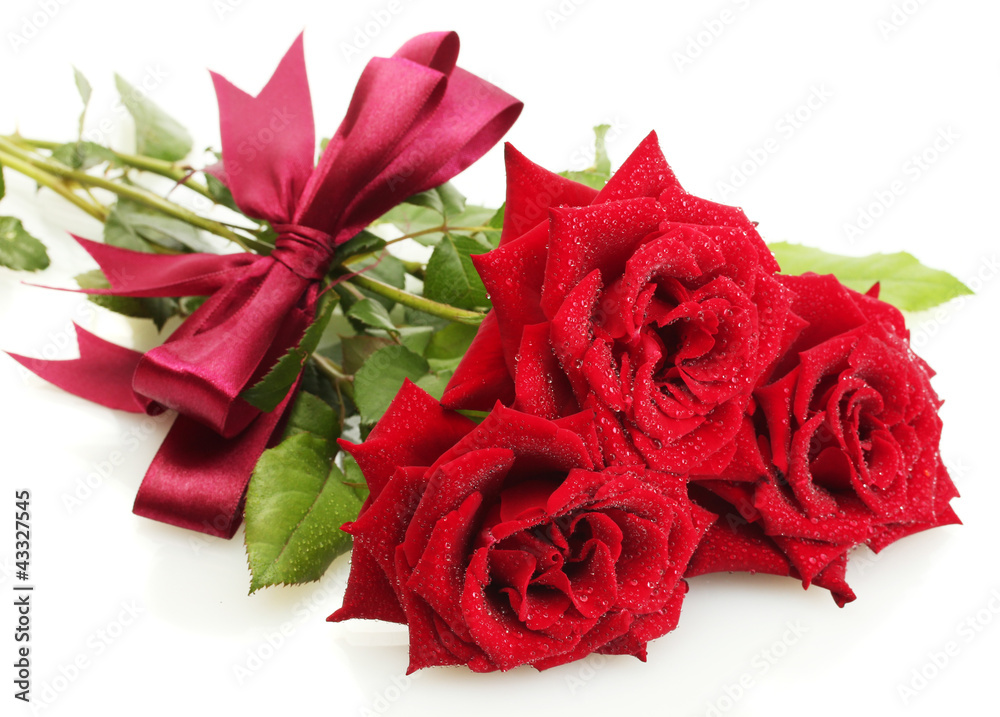 three beautiful red roses with drops isolated on white