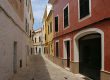 Street With Colorful Houses In Old Town Of Ciutadella - Minorca