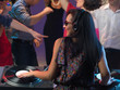 © Daco - woman dj entertaining crowd in night club
