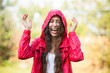 © pikselstock - Joyful woman playing in rain