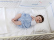 © Leonid & Anna Dedukh - little child baby boy lying on the bed indoors in baby room