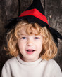 © Sunny studio - Funny kid in hand of witch