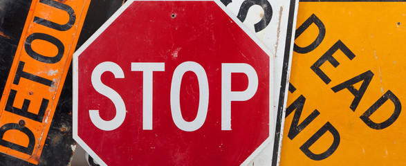 A group of assorted vintage traffic signs forming a background