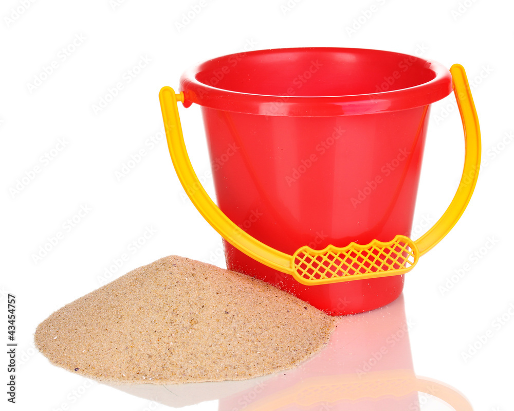 Children's bucket and sand isolated on white