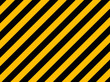 © pockygallery11 - Yellow and black diagonal hazard stripes painted on old brick wa