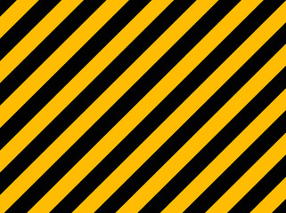 Yellow and black diagonal hazard stripes painted on old brick wa