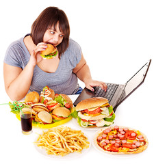 Woman eating junk food.