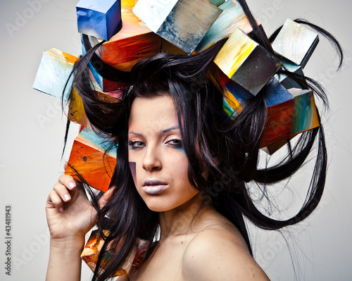 Naklejka - mata magnetyczna na lodówkę portrait of beautiful young girl with cubes on head.