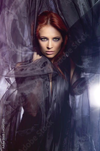 Naklejka - mata magnetyczna na lodówkę A young redhead woman in a beautiful dress covered with silk
