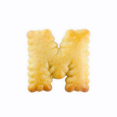 Fototapete - M-shape cracker in the form of alphabet