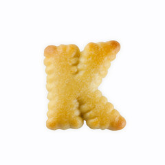 Fototapete - K-shape cracker in the form of alphabet