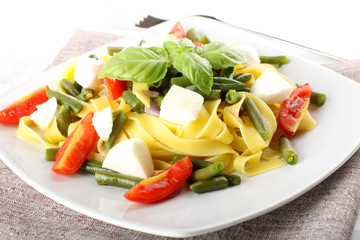 Wall Mural - Fettuccine with green beans, mozzarella and tomato