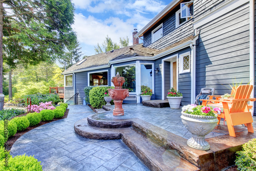 Blue house entrance with fountain and nice patio. - Buy this stock ... Blue house entrance with fountain and nice patio. - Buy this stock ...
