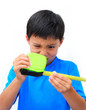 Boy in Blue Shirt with Measuring Tape on White Background