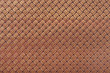 Brown leather background with interlaced design