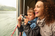 © Pavel Losevsky - Mother with her son float at passengers vessel, boy makes photo