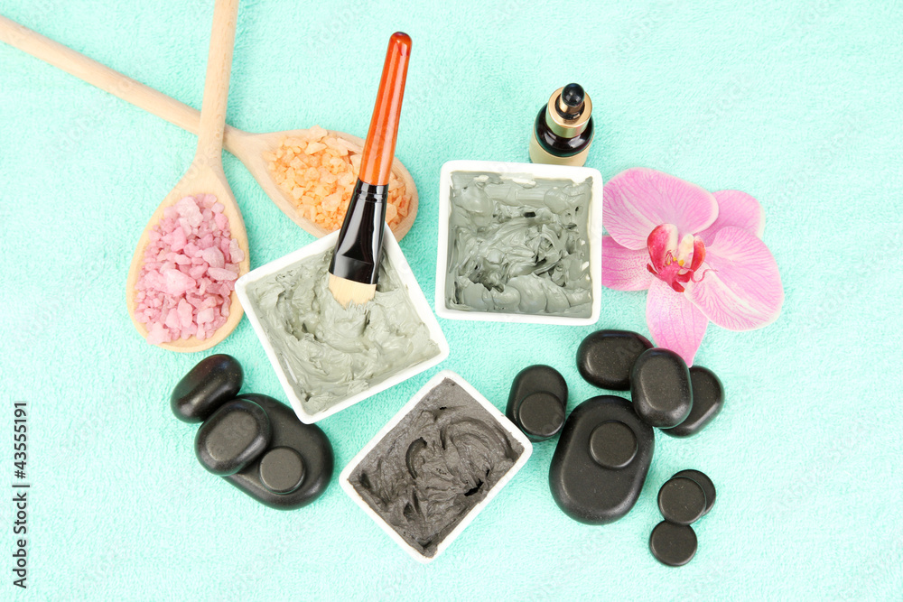 cosmetic clay for spa treatments on blue background close-up