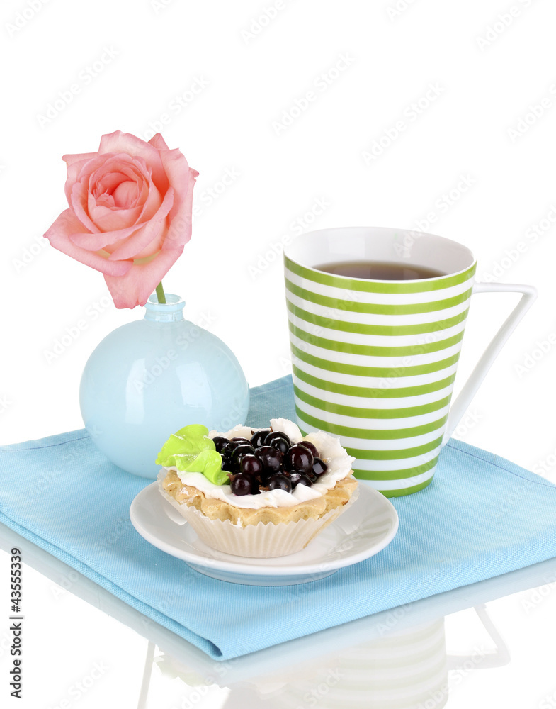 sweet cake with cup of tea isolated on white