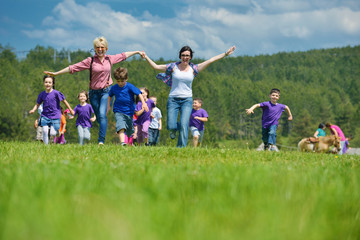 Wall Mural - happy kids group  have fun in nature