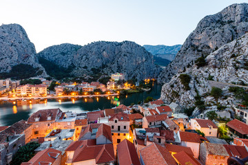 Fototapete - Arial View on Illuminated Town of Omis in the Evening, Croatia