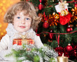 © Sunny studio - Happy child holding gift